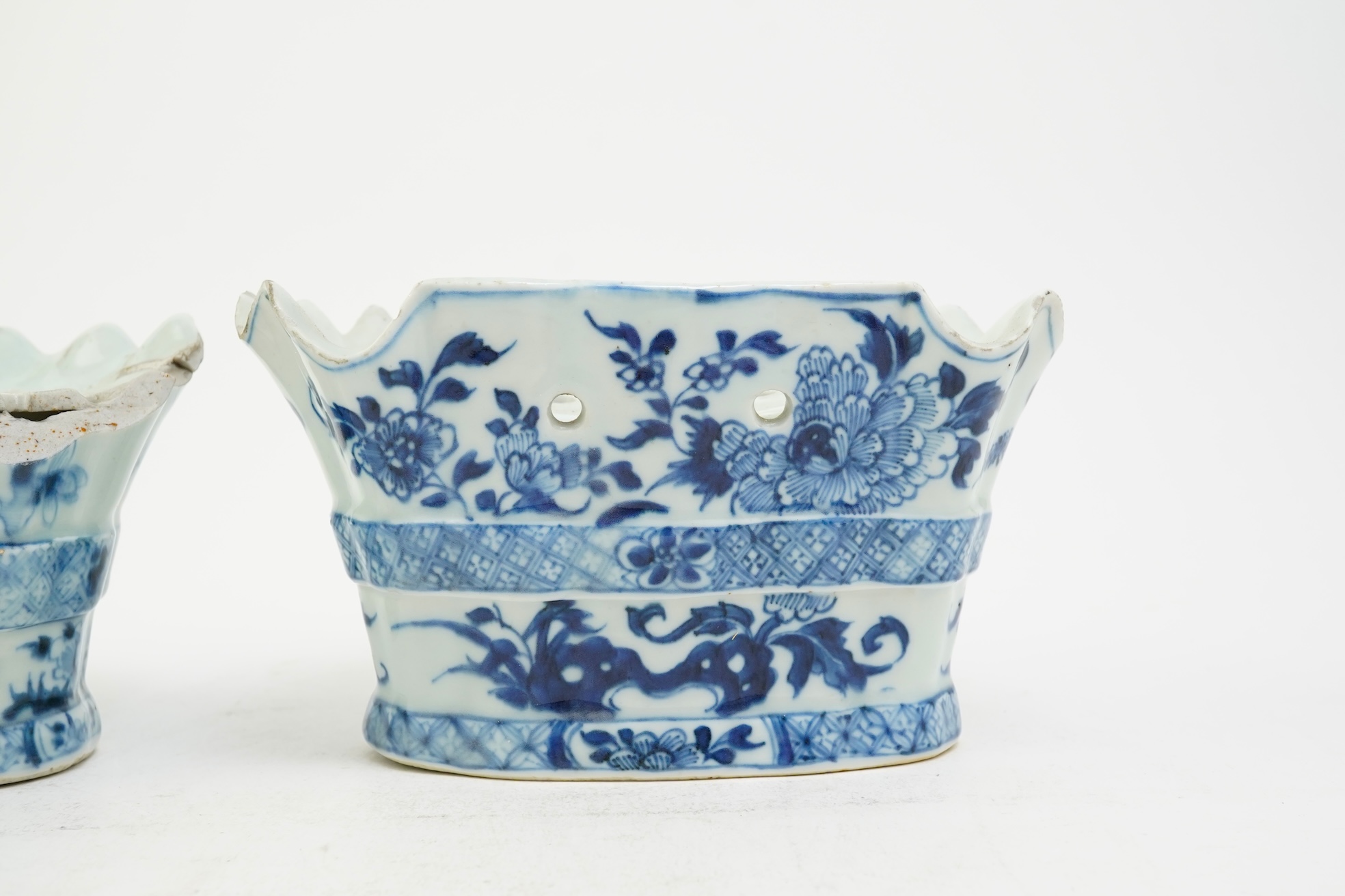 A pair of unusual Chinese export blue and white bough pots, after a Delft model, Qianlong period
